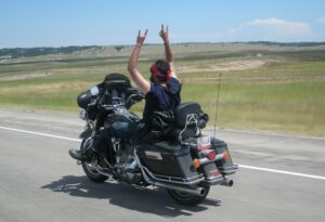 Photo of Phil riding motorcycle without holding handlebars